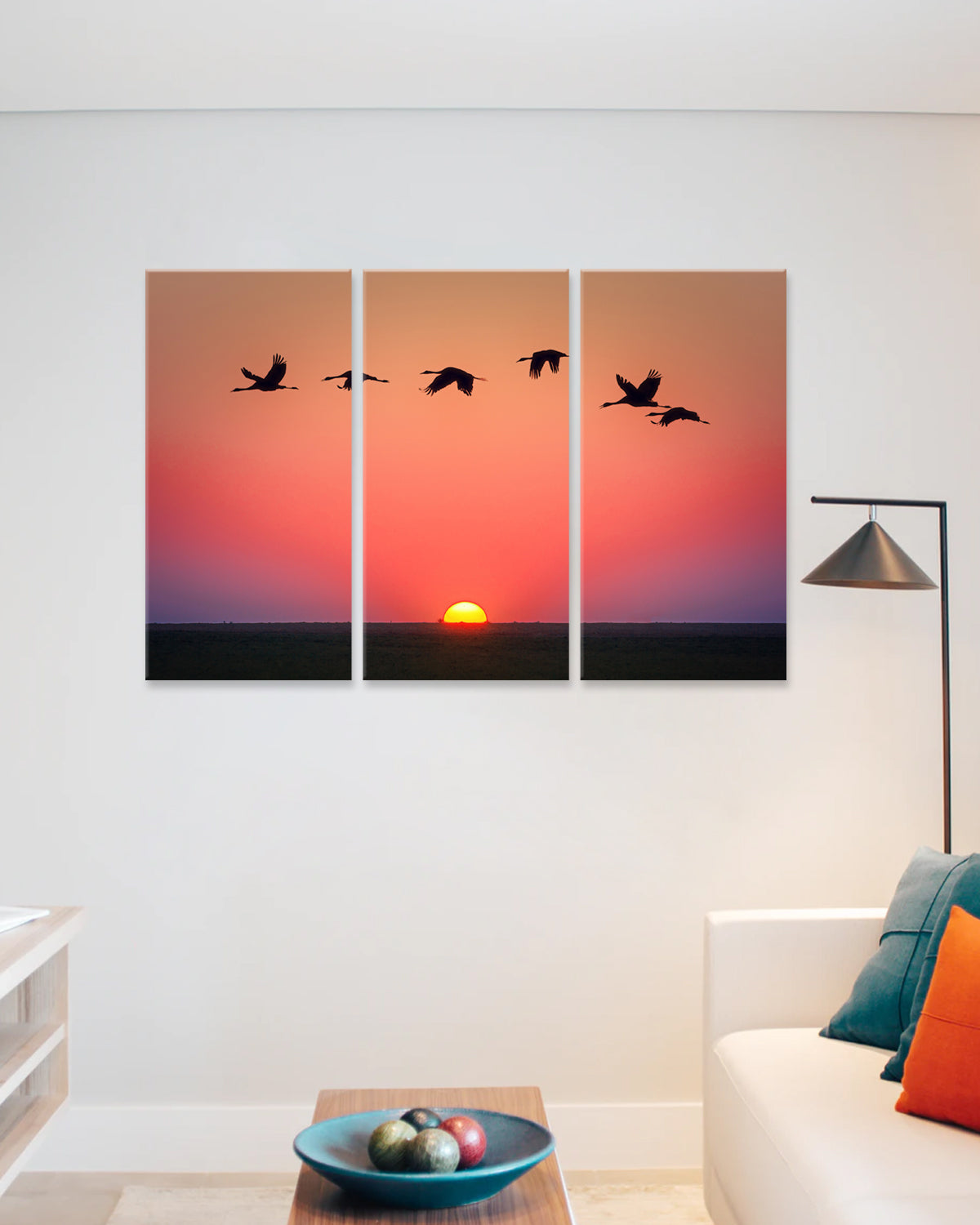 Birds Flying Over the Sunset